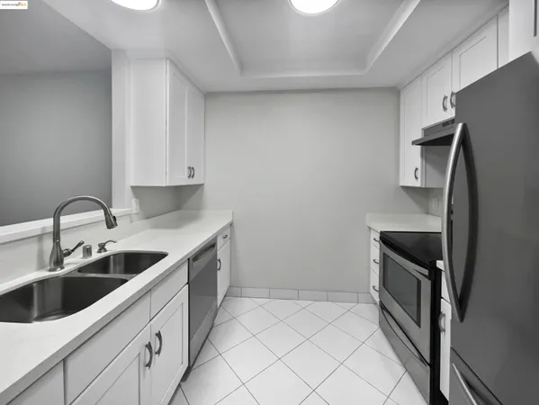 a kitchen with a sink and an oven
