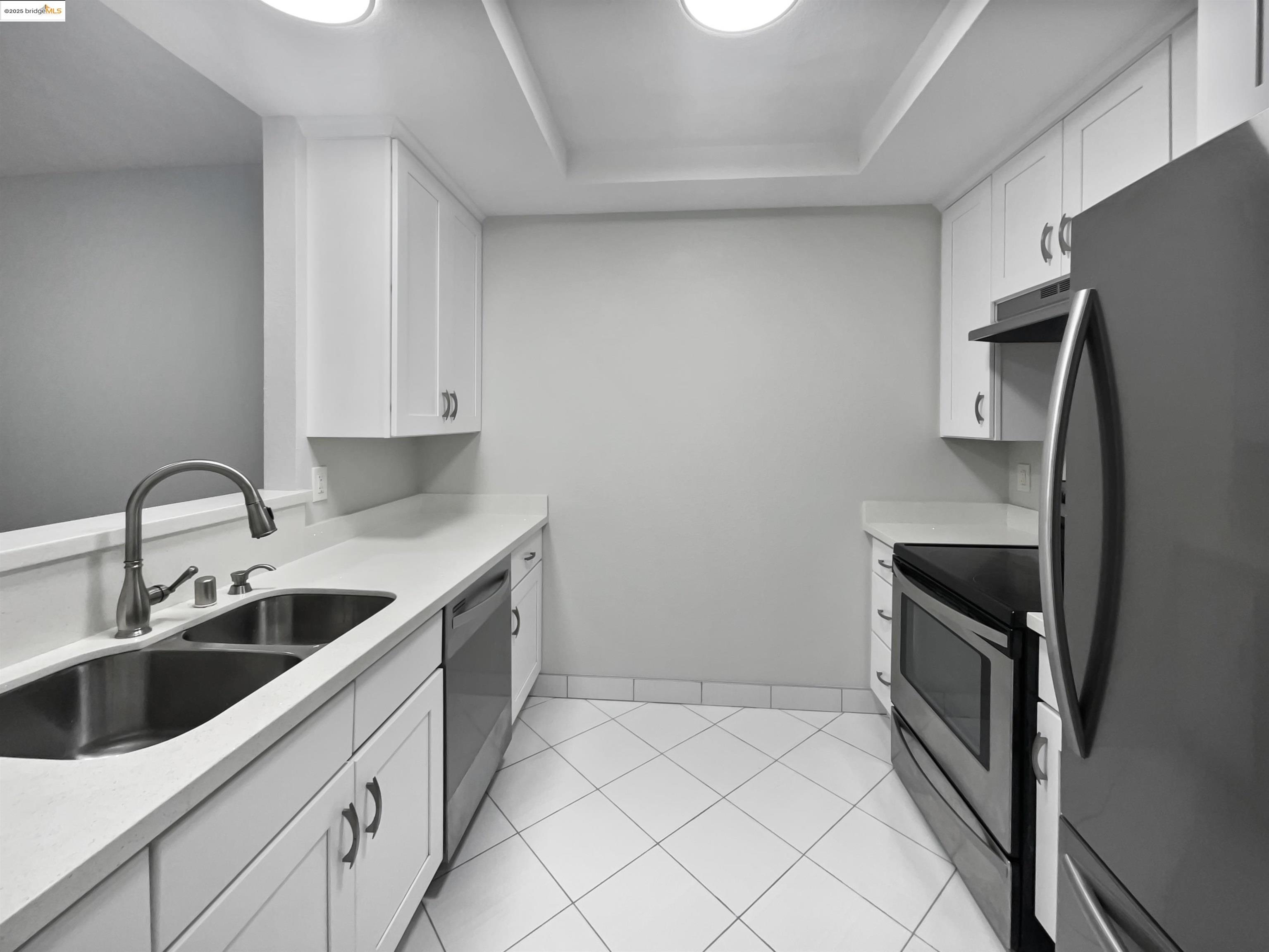 39965 Parada Street, Unit A Newark, CA 94560 - Photo 1 of 1 a kitchen with a sink and an oven