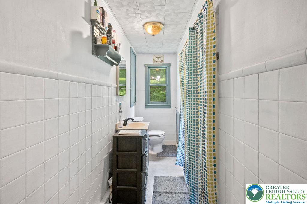1644 Moselem Spring Road Hamburg, PA 19526 - Photo 11 of 24 a bathroom with a sink and a mirror