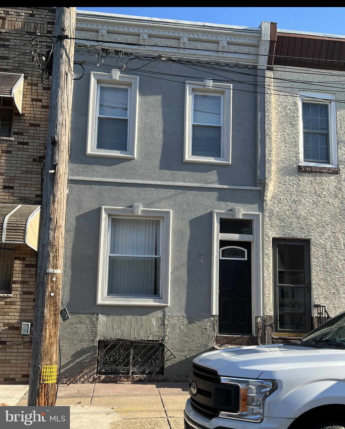 3167 East Thompson Street Philadelphia, PA 19134 - Photo 1 of 26 a front view of a house with a tree