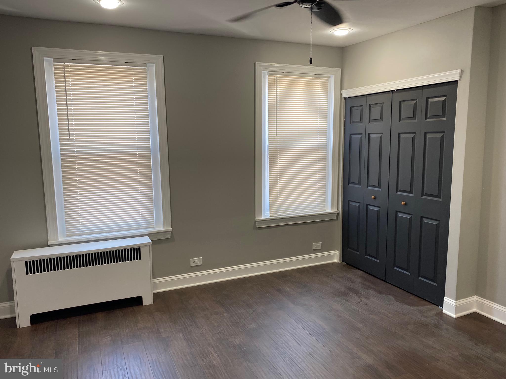3167 East Thompson Street Philadelphia, PA 19134 - Photo 12 of 26 an empty room with wooden floor and windows