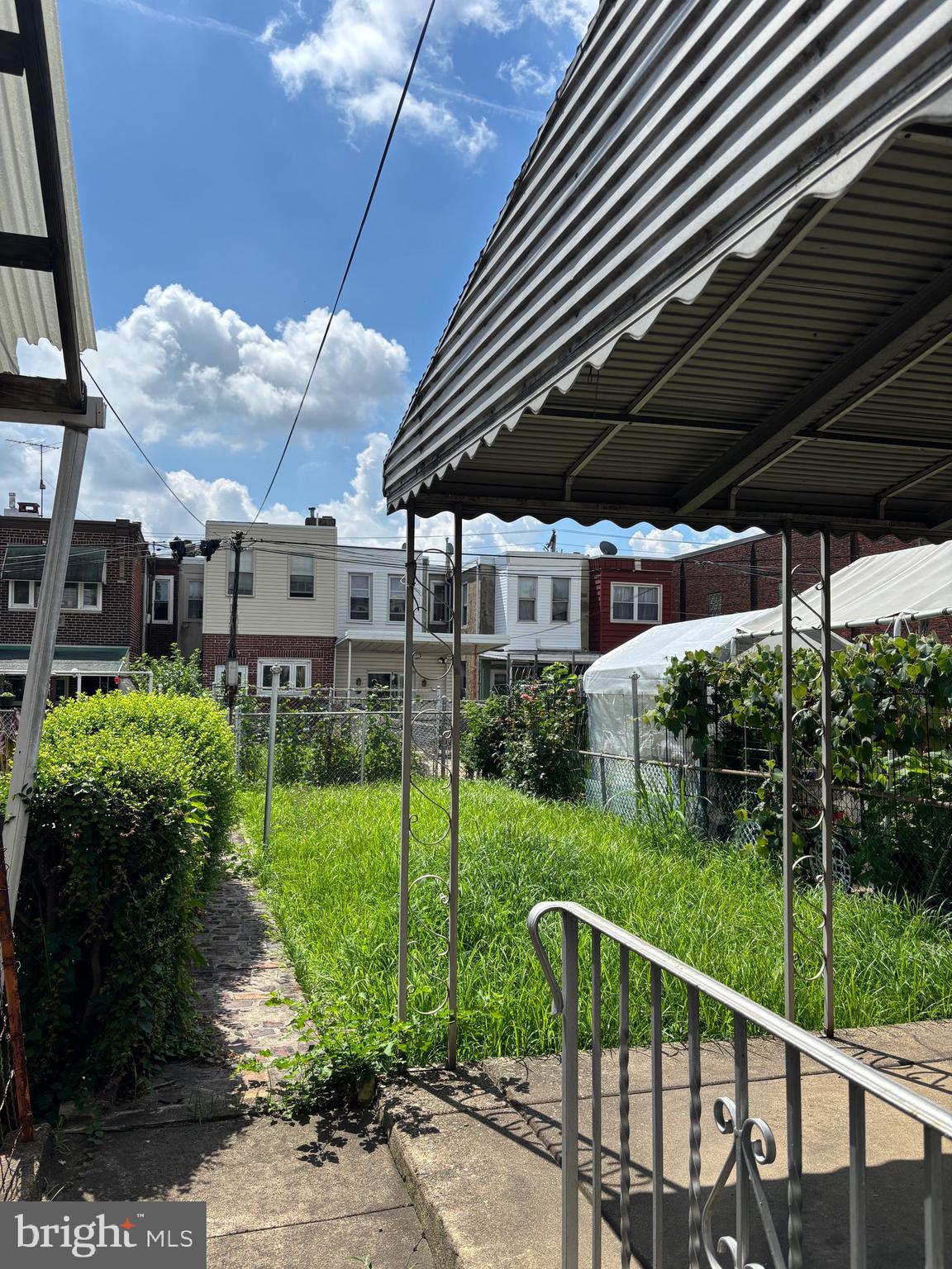 3167 East Thompson Street Philadelphia, PA 19134 - Photo 26 of 26 a view of a deck with a table and chairs under an umbrella