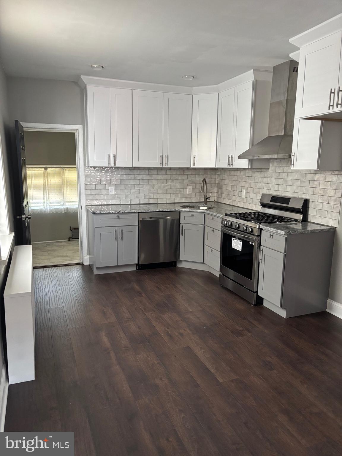 3167 East Thompson Street Philadelphia, PA 19134 - Photo 4 of 26 a kitchen with stainless steel appliances granite countertop a stove a sink and a refrigerator