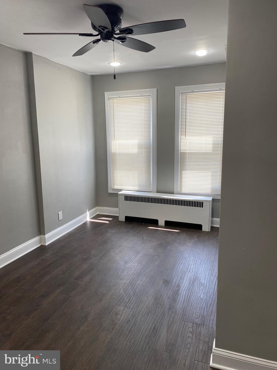 3167 East Thompson Street Philadelphia, PA 19134 - Photo 9 of 26 an empty room with wooden floor and window