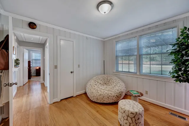 an entryway and livingroom with furniture