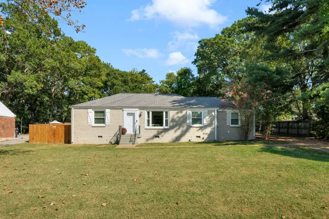 a house with trees in the background