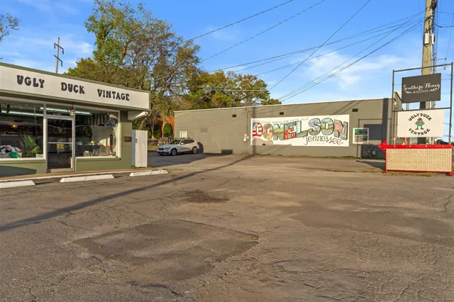 a view of a city street with cars