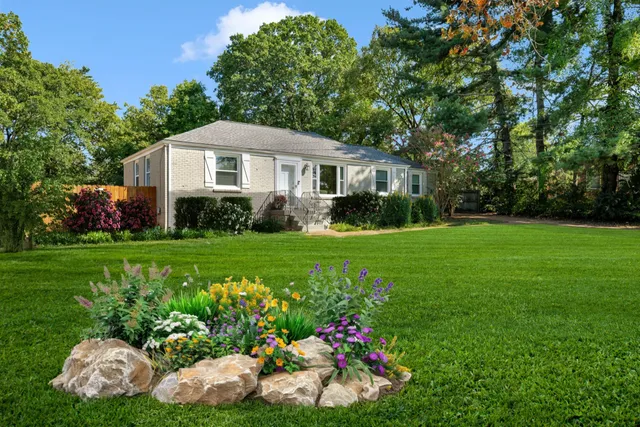 a front view of a house with garden