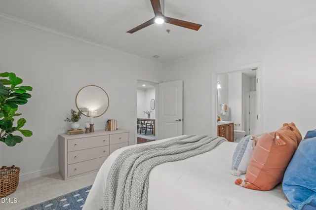 a bedroom with bed and wooden floor