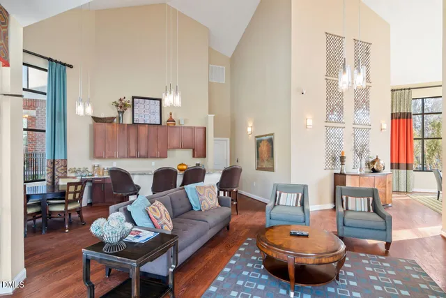 a view of a house with swimming pool and sitting area