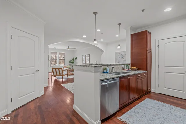 a kitchen with stainless steel appliances granite countertop a stove and a refrigerator