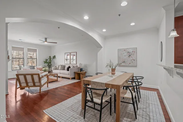 a view of a dining room with furniture and wooden floor
