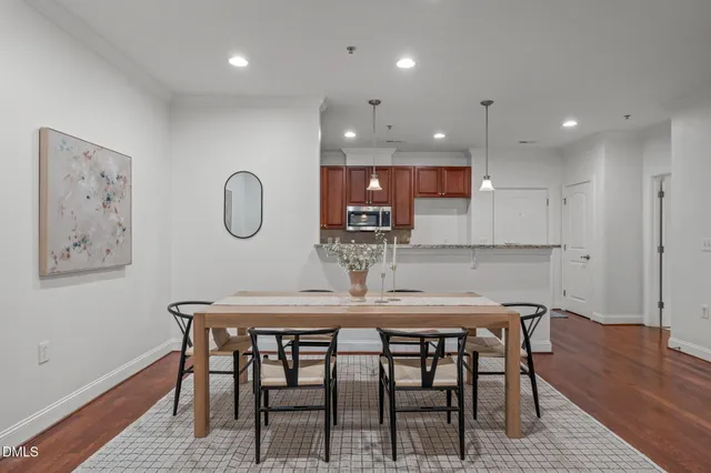 a kitchen with a table and chairs in it