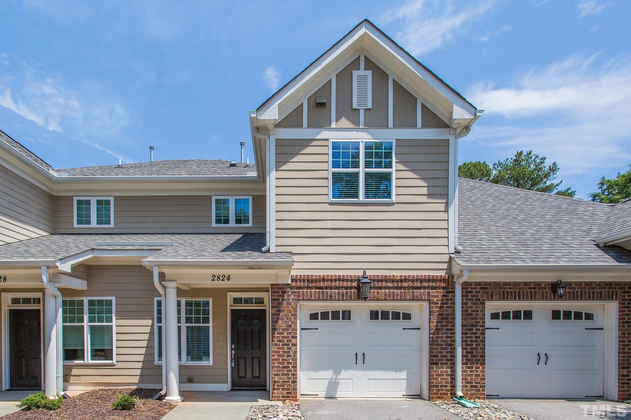 2824 Plumfield Place Raleigh, NC 27607 - Photo 1 of 21 a front view of a house with a yard