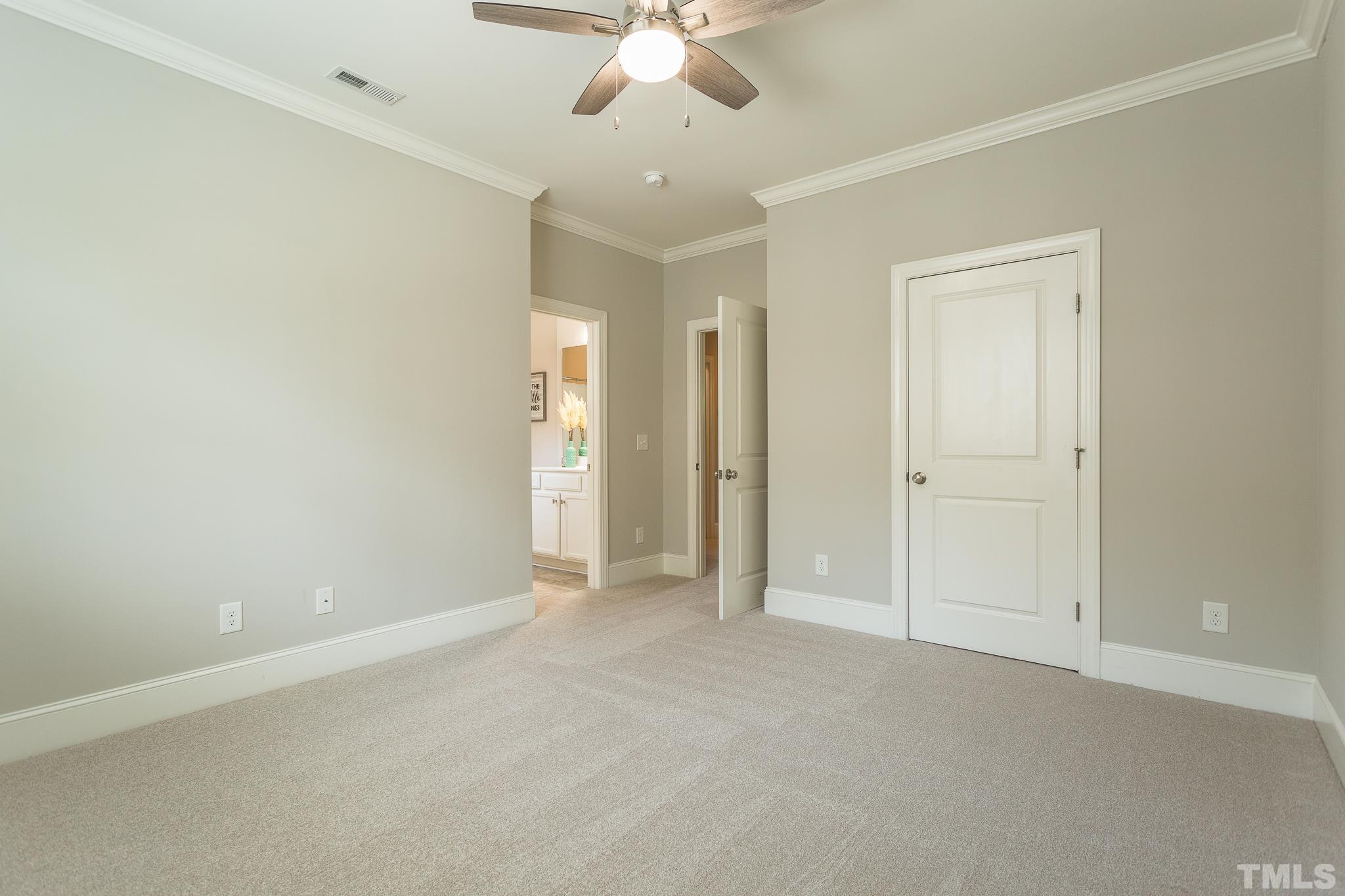 2824 Plumfield Place Raleigh, NC 27607 - Photo 12 of 21 an empty room with a ceiling fan and a window