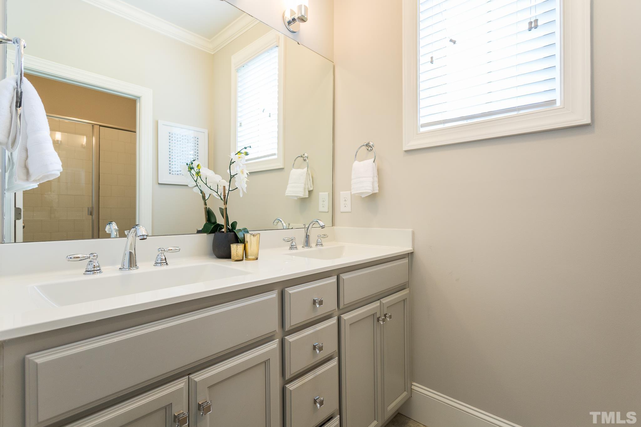 2824 Plumfield Place Raleigh, NC 27607 - Photo 15 of 21 a bathroom with a sink and a mirror