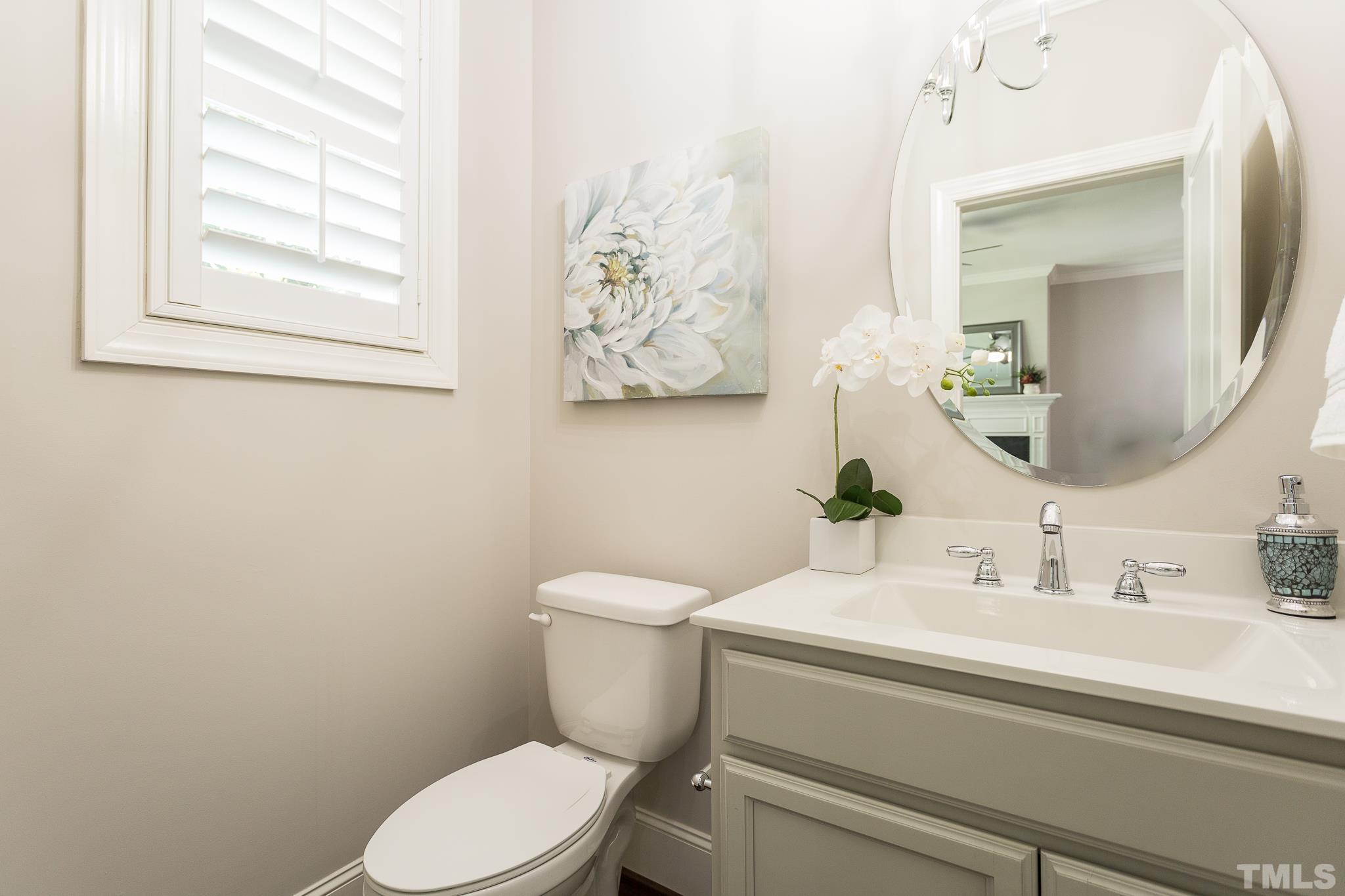 2824 Plumfield Place Raleigh, NC 27607 - Photo 16 of 21 a bathroom with a toilet sink and mirror