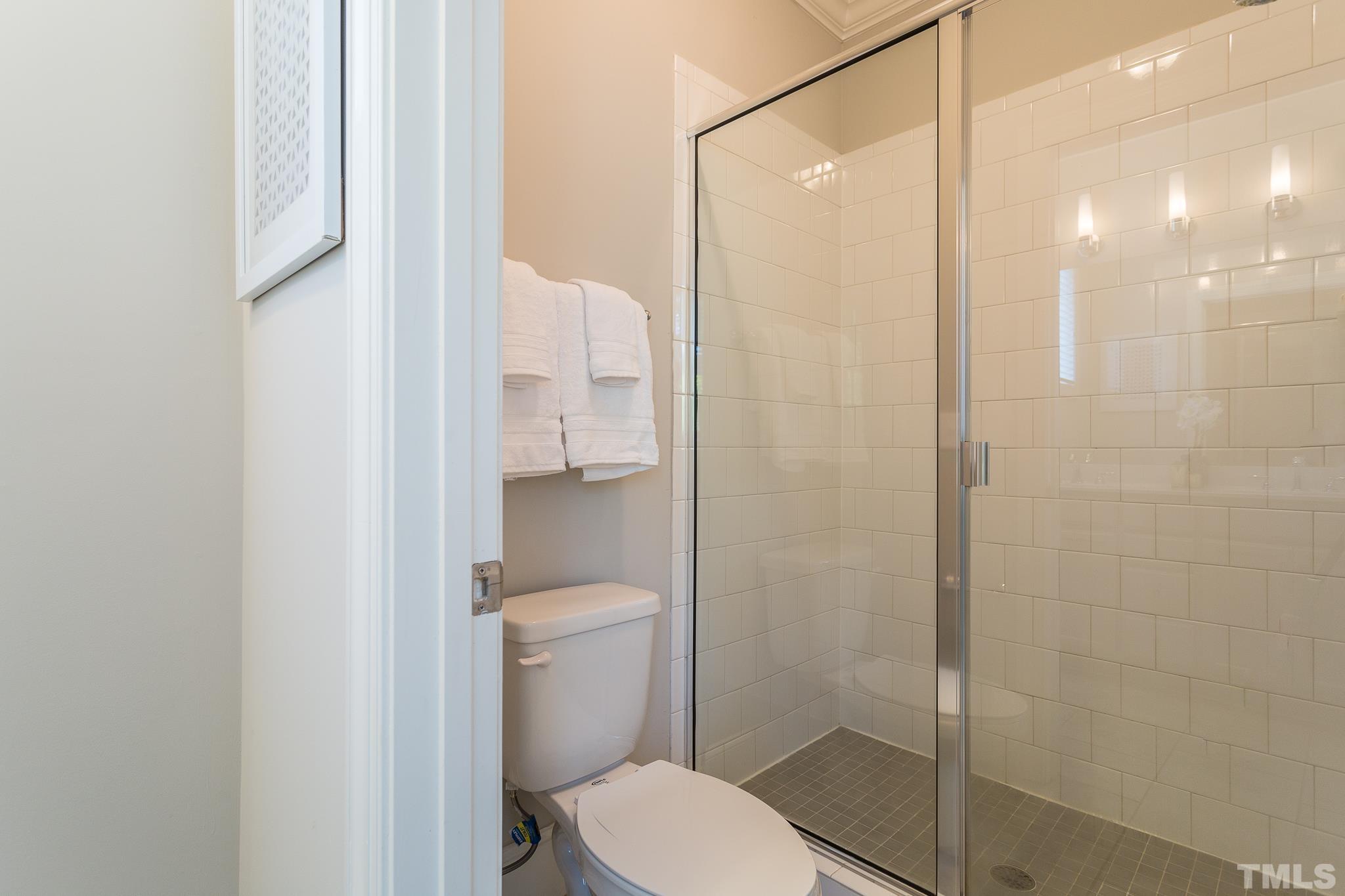 2824 Plumfield Place Raleigh, NC 27607 - Photo 17 of 21 a bathroom with a toilet and a shower