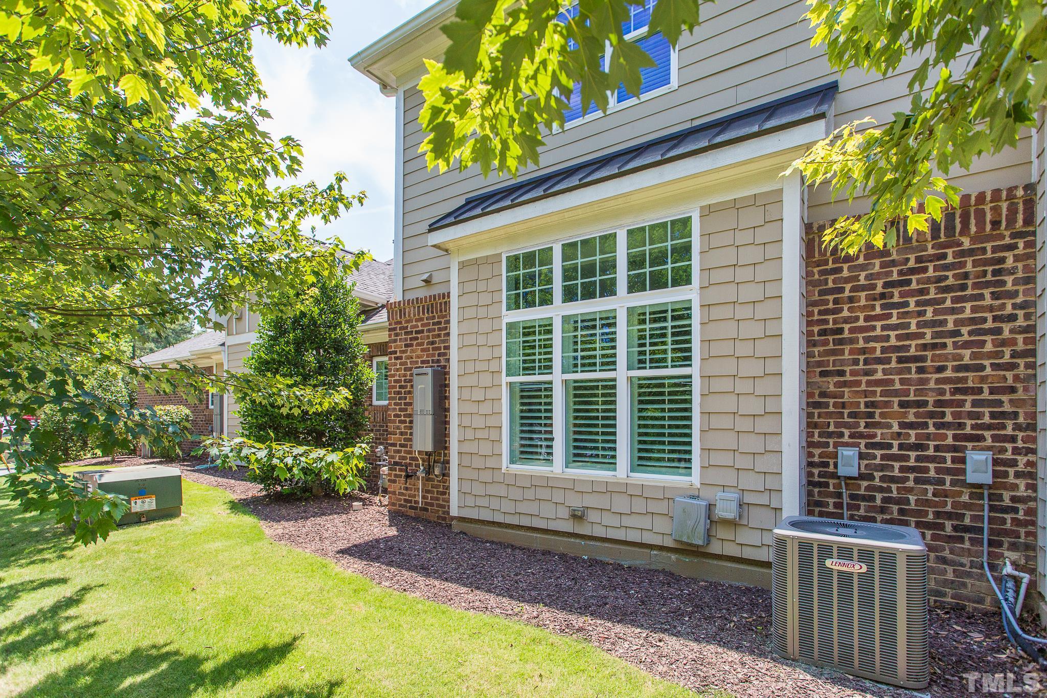 2824 Plumfield Place Raleigh, NC 27607 - Photo 20 of 21 a view of front door of house with outdoor seating