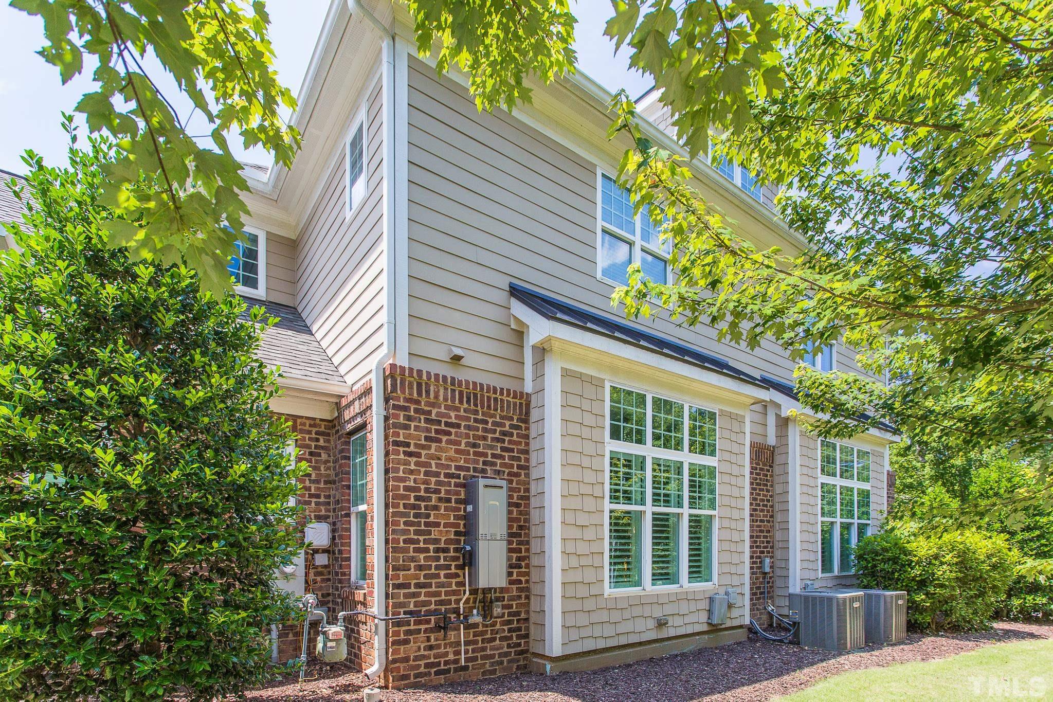 2824 Plumfield Place Raleigh, NC 27607 - Photo 21 of 21 a view of a house with a tree