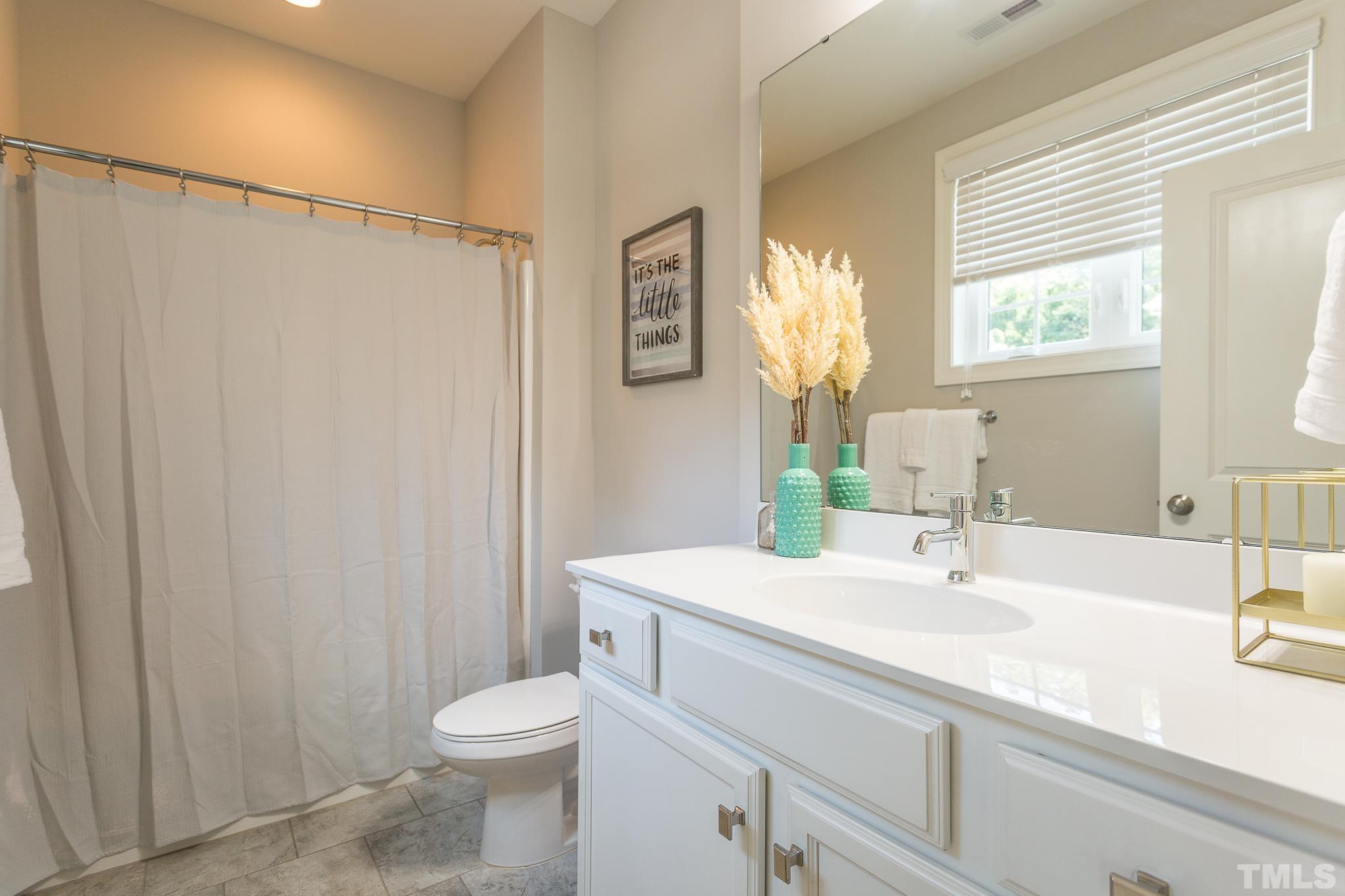 2824 Plumfield Place Raleigh, NC 27607 - Photo 6 of 21 a bathroom with a sink a toilet and shower
