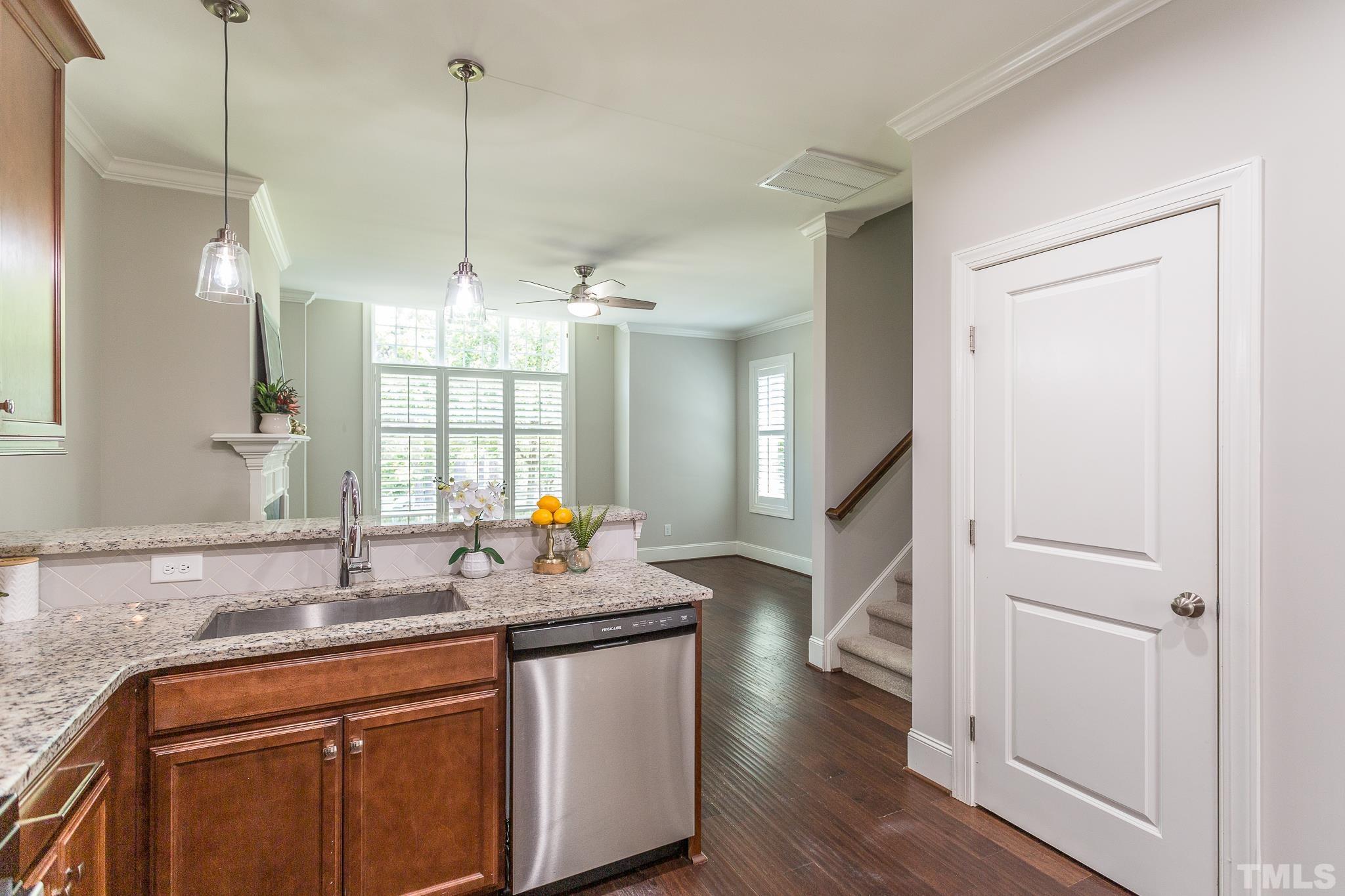 2824 Plumfield Place Raleigh, NC 27607 - Photo 7 of 21 a kitchen with sink refrigerator and wooden floor
