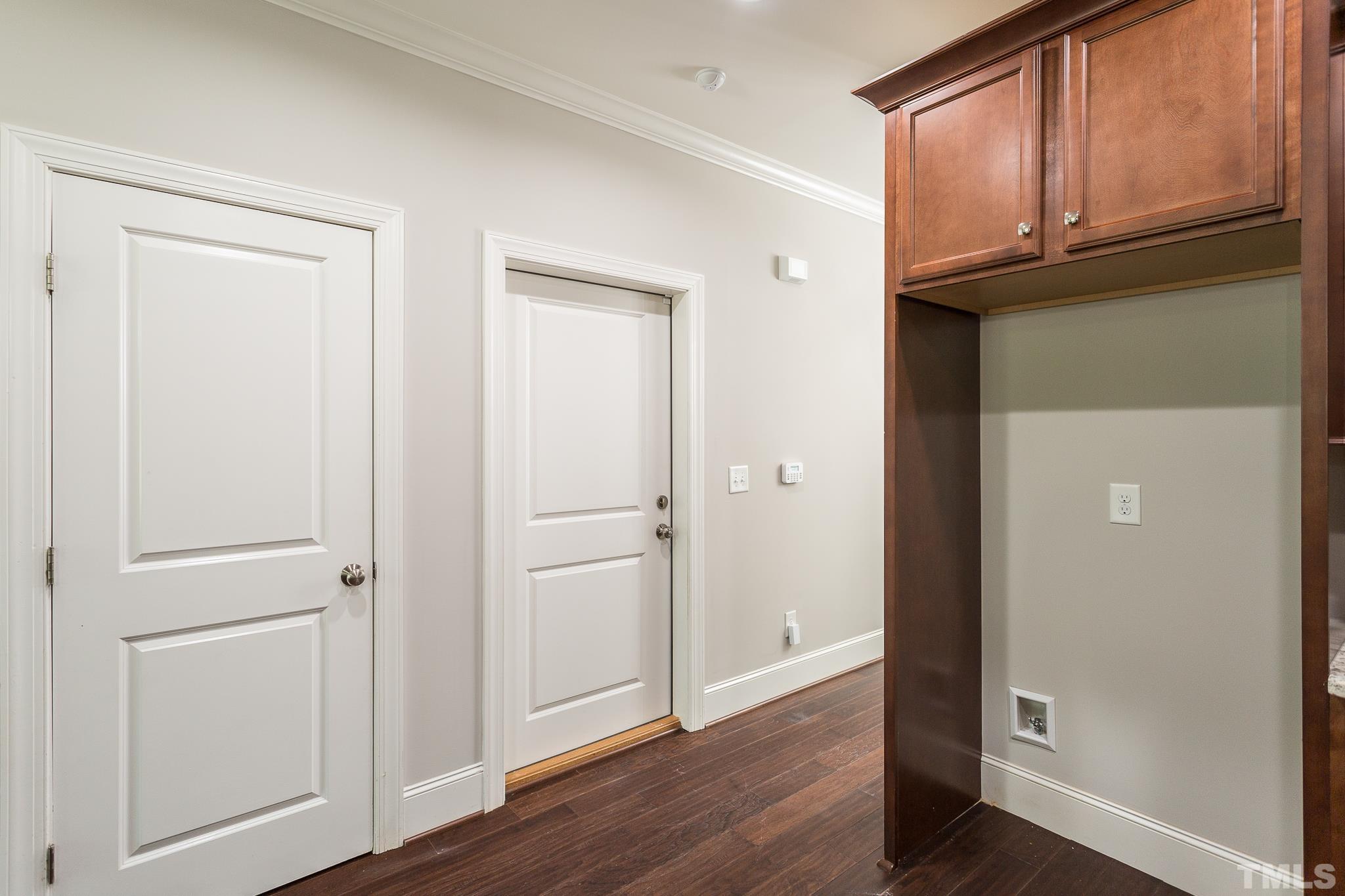 2824 Plumfield Place Raleigh, NC 27607 - Photo 8 of 21 a view of a hallway with wooden floor