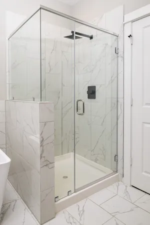 a view of an empty room and wooden floor