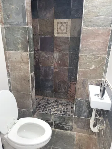 a bathroom with a toilet and a sink