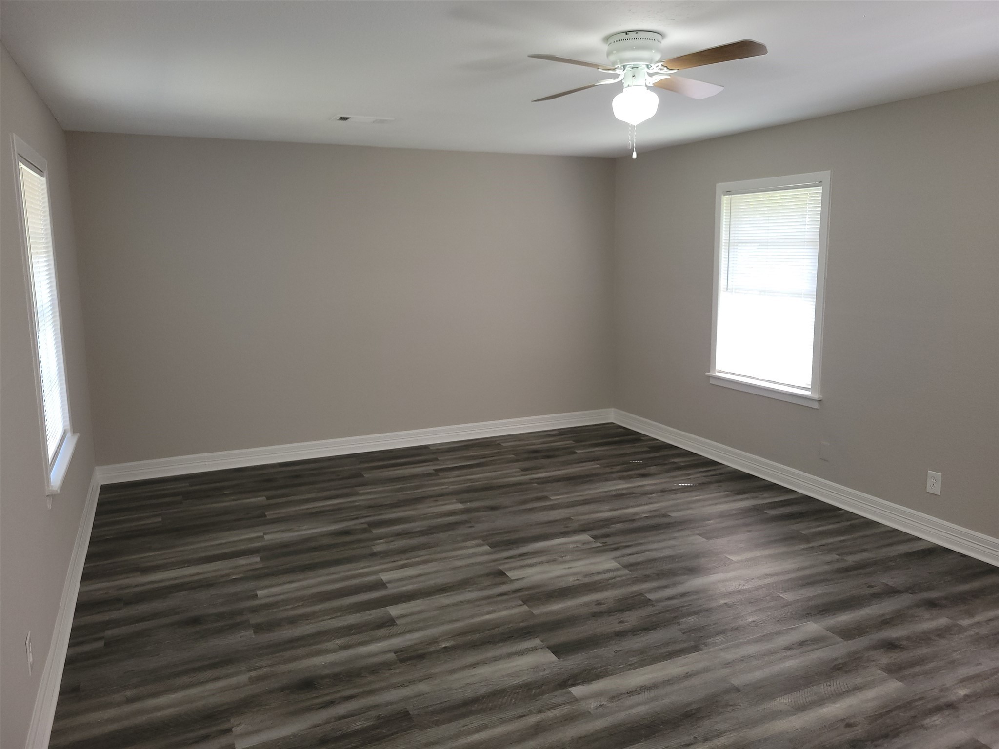 7803 Broadview Drive Houston, TX 77061 - Photo 5 of 13 wooden floor in an empty room with a window