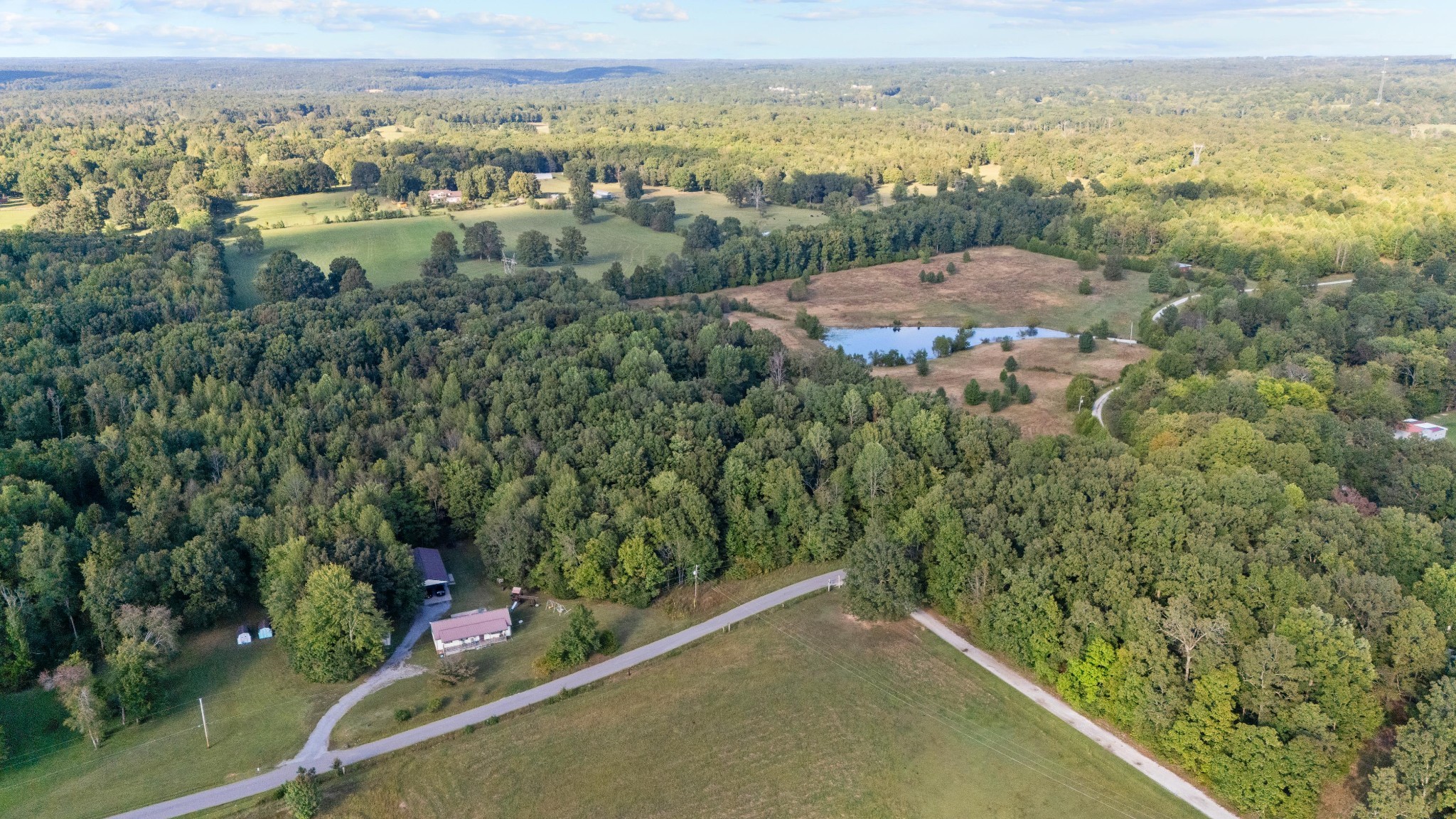 1127 Pruett Road Dickson, TN 37055 - Photo 32 of 39 an aerial view of residential houses with outdoor space and trees