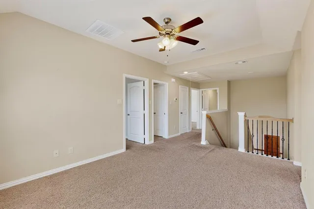 a view of a livingroom with a ceiling fan