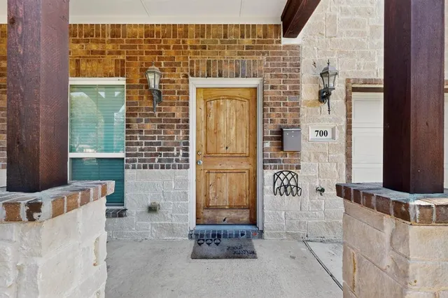 a view of an entryway with wooden floor and staircase