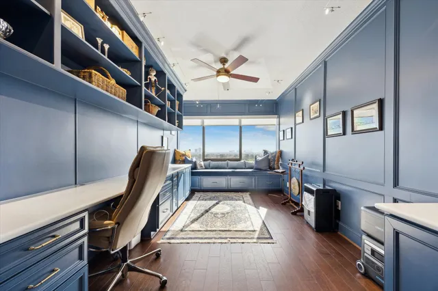 a kitchen with stainless steel appliances granite countertop lots of counter top space and wooden floor