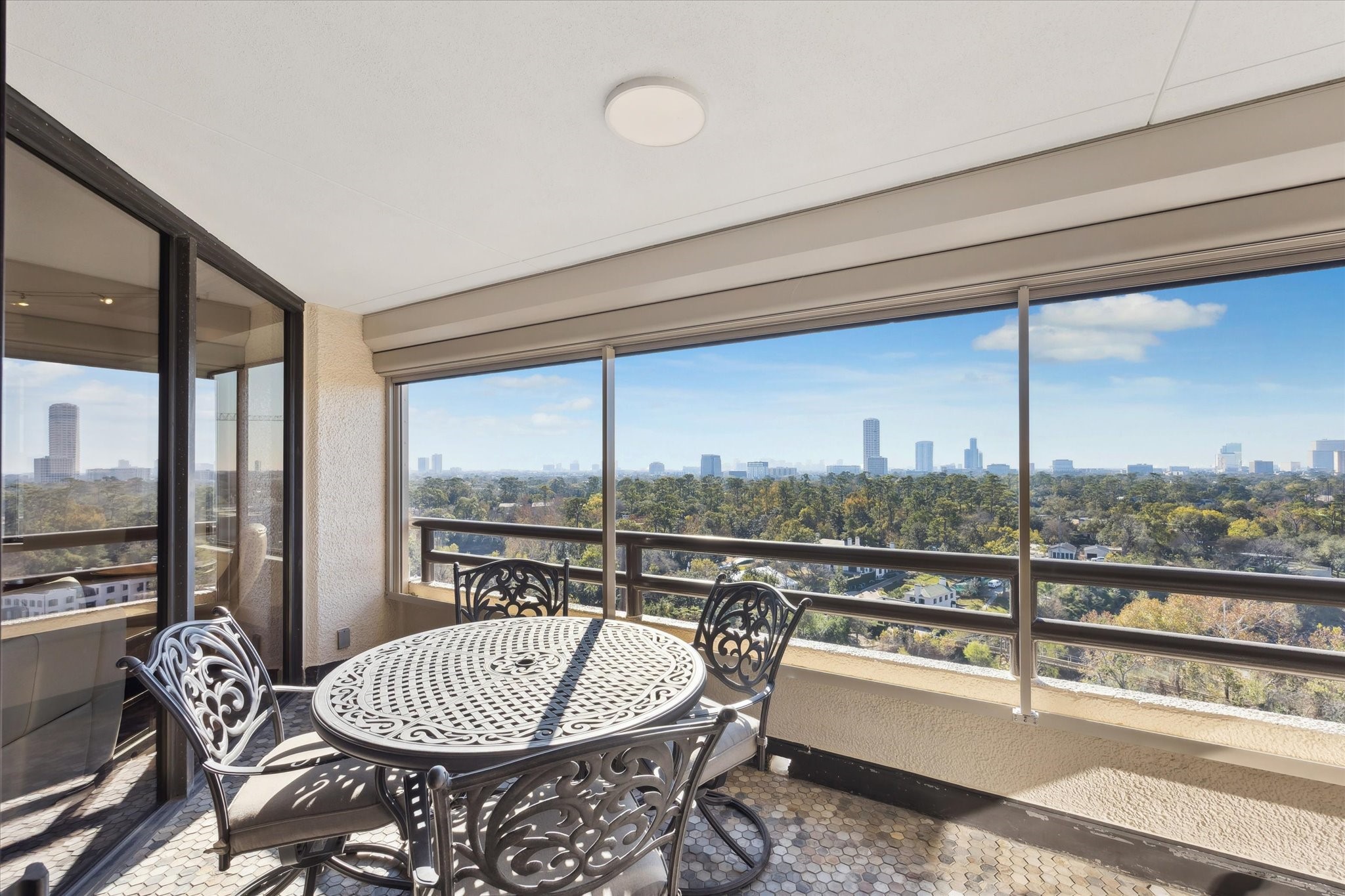 101 Westcott Street, Unit 1202 Houston, TX 77007 - Photo 27 of 38 a living room with furniture and a floor to ceiling window