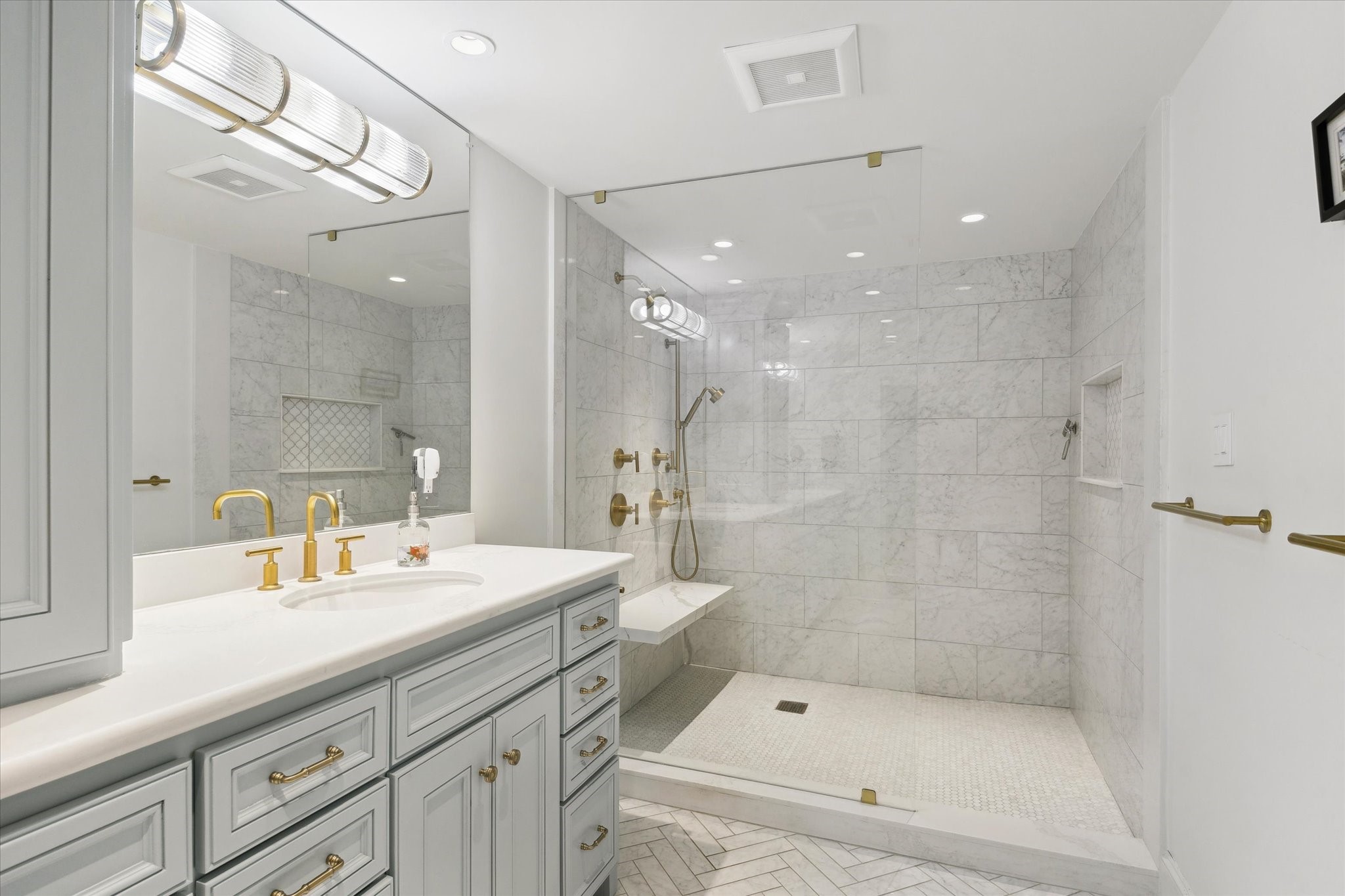 101 Westcott Street, Unit 1202 Houston, TX 77007 - Photo 28 of 38 a bathroom with a double vanity sink mirror double shower and a bathtub