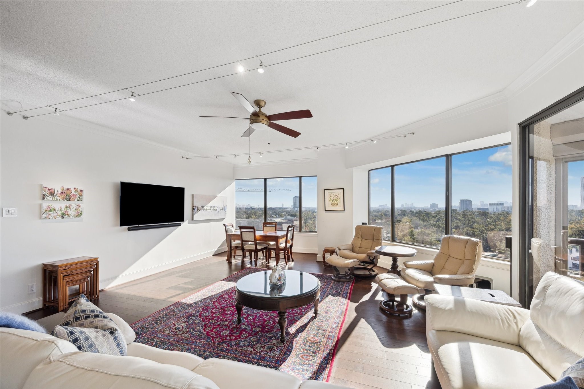 101 Westcott Street, Unit 1202 Houston, TX 77007 - Photo 7 of 38 a living room with furniture and a flat screen tv