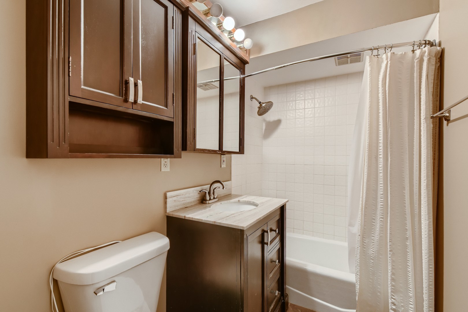 1750 Elliott Street Park Ridge, IL 60068 - Photo 17 of 22 a bathroom with a sink a toilet and shower