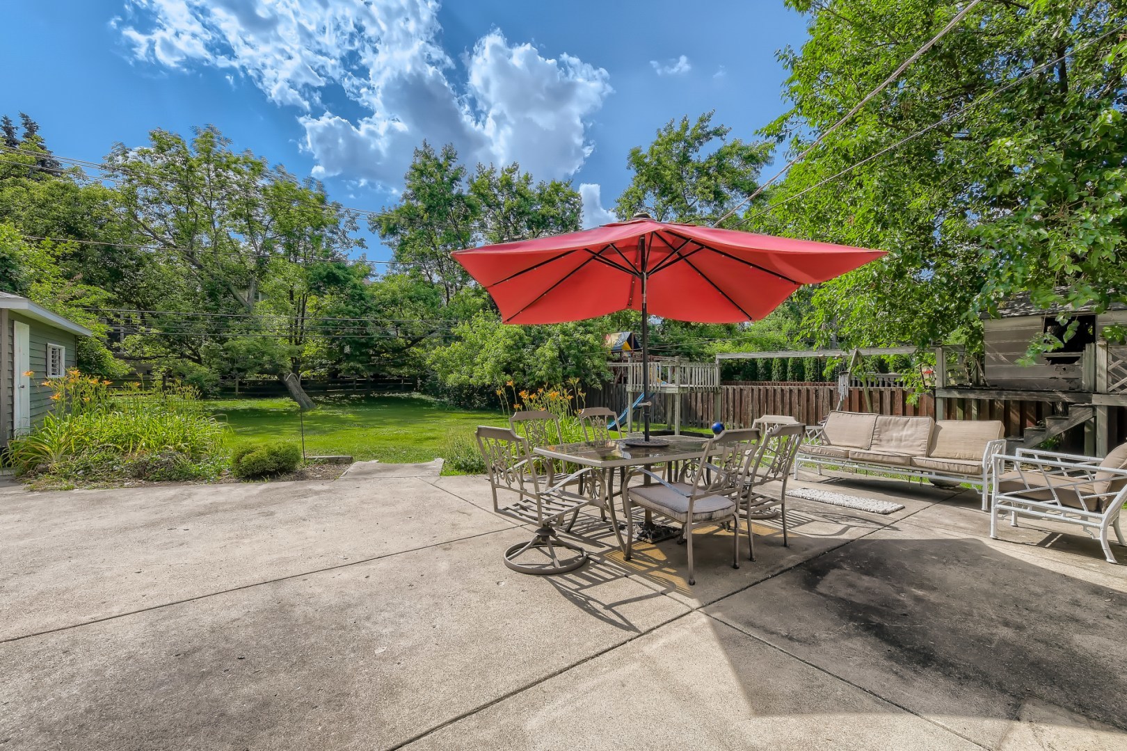 1750 Elliott Street Park Ridge, IL 60068 - Photo 20 of 22 a view of backyard with sitting area and umbrella