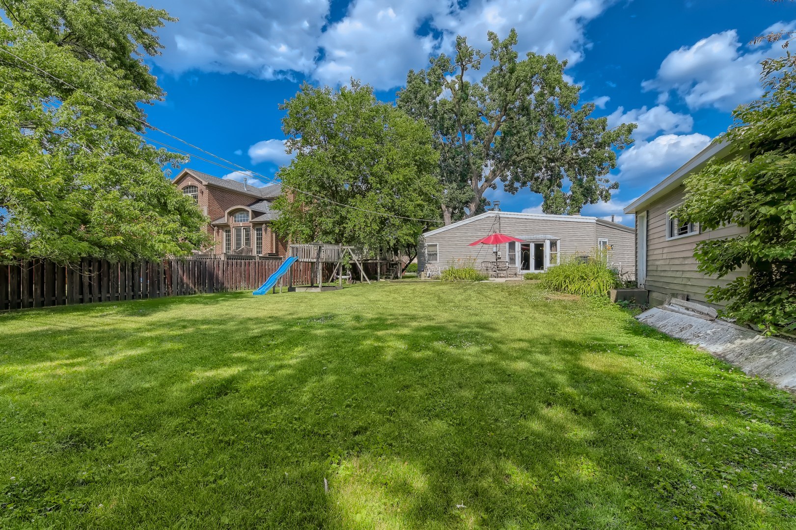 1750 Elliott Street Park Ridge, IL 60068 - Photo 21 of 22 a view of an house with backyard and a tree