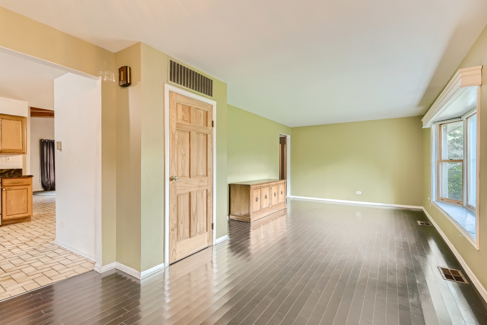 1750 Elliott Street Park Ridge, IL 60068 - Photo 3 of 22 a view of a hallway with wooden floor and a living room