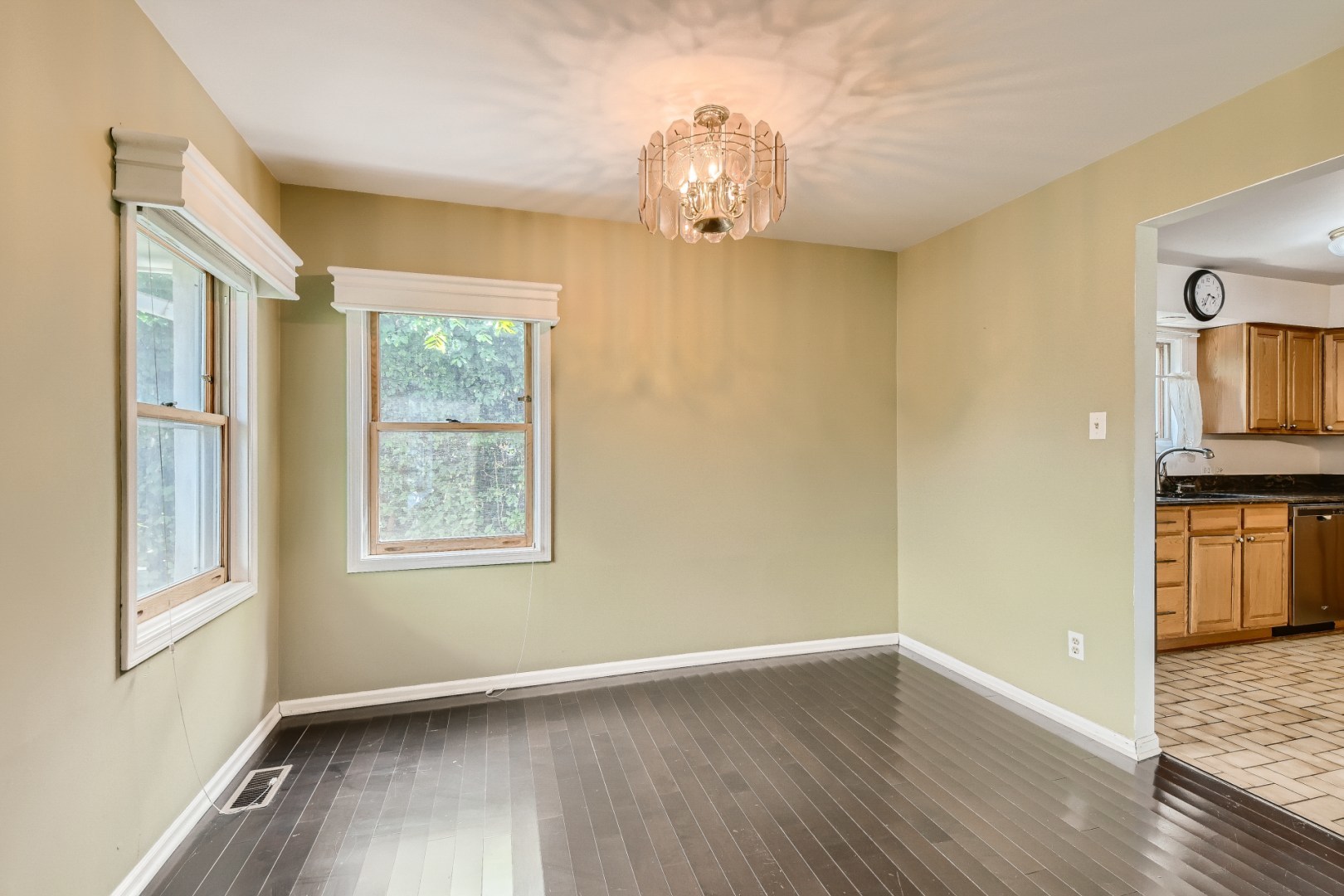1750 Elliott Street Park Ridge, IL 60068 - Photo 5 of 22 a view of an empty room with wooden floor and a window
