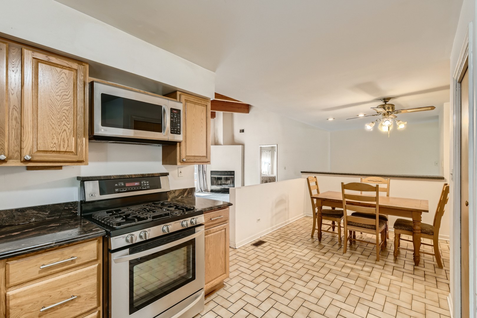 1750 Elliott Street Park Ridge, IL 60068 - Photo 8 of 22 a kitchen with a stove and a microwave oven