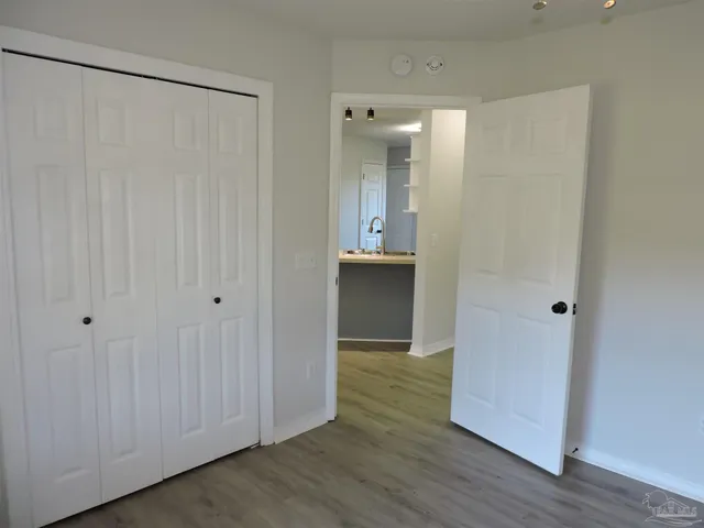 a view of a bathroom with wooden floor