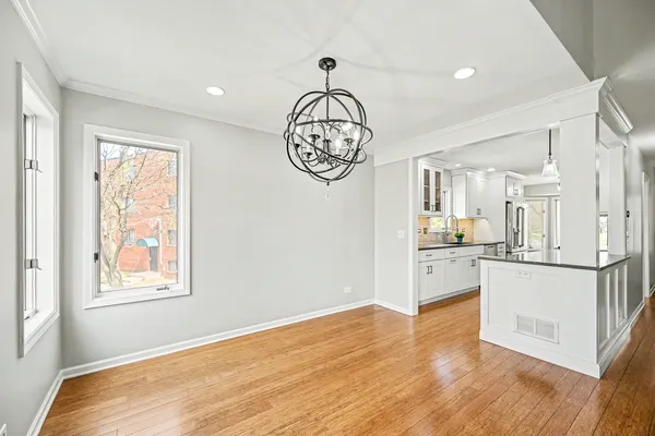 a very nice looking room with wooden floor and a window