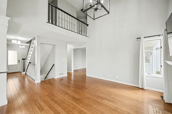a view of an entryway with wooden floor