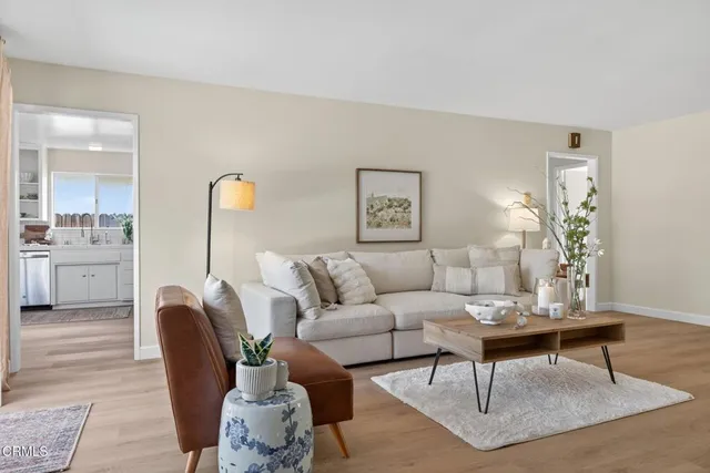 a living room with furniture and a table