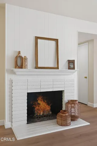 a kitchen with stainless steel appliances granite countertop a stove and white cabinets