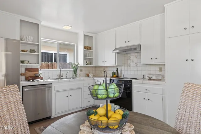 a bed room with a bed and a chair