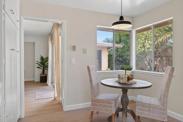 a bathroom with a granite countertop sink a potted plant and a shower